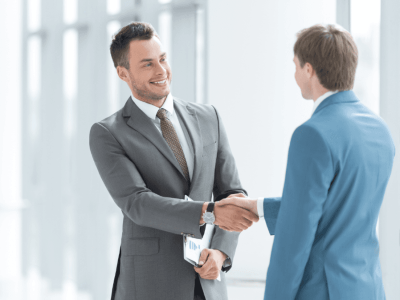 Sales team discussing strategy around a table